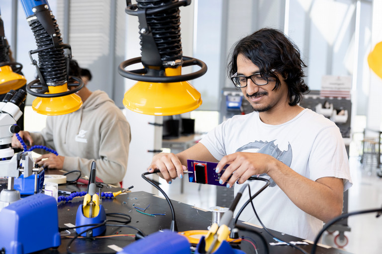An ISE students in an ISE Lab working on circuits