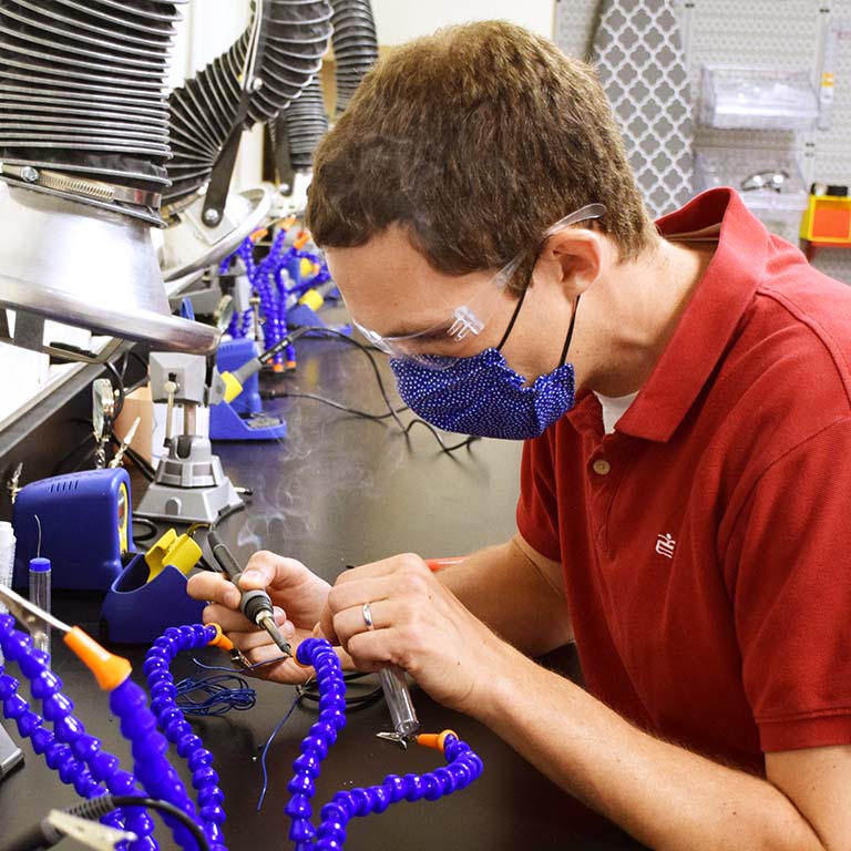 A student working in the luddy LLC lab