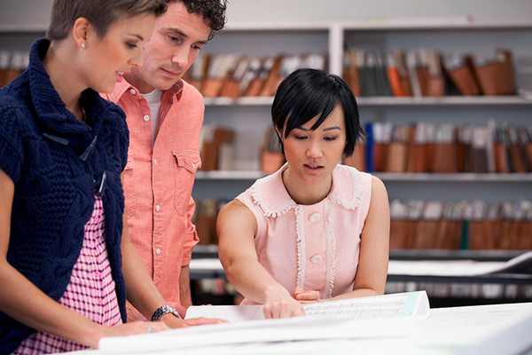 students looking through over archived papers