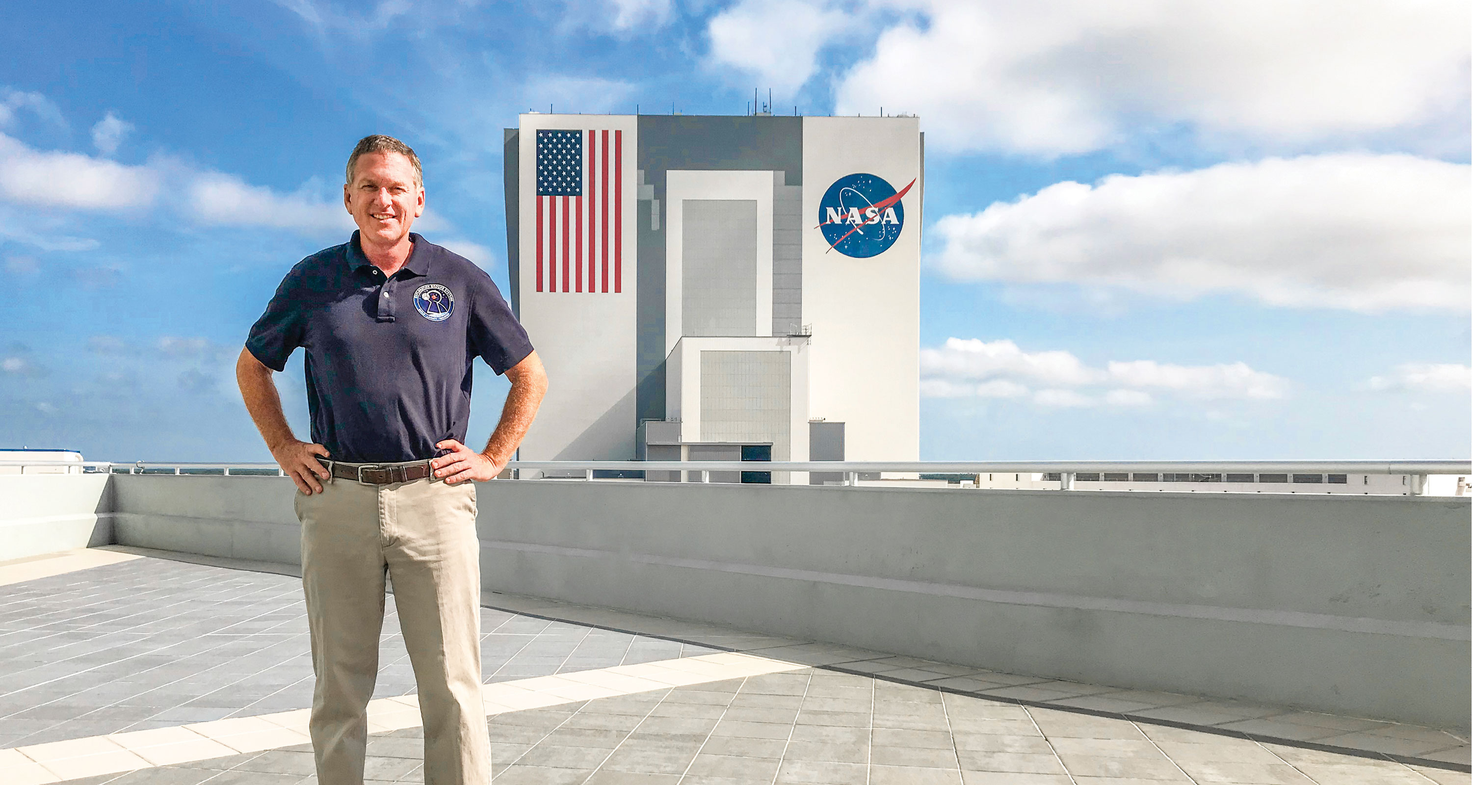 Professor Mike Bolger standing in front of the NASA command center